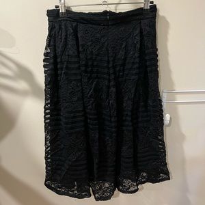 Mid length lacy black skirt